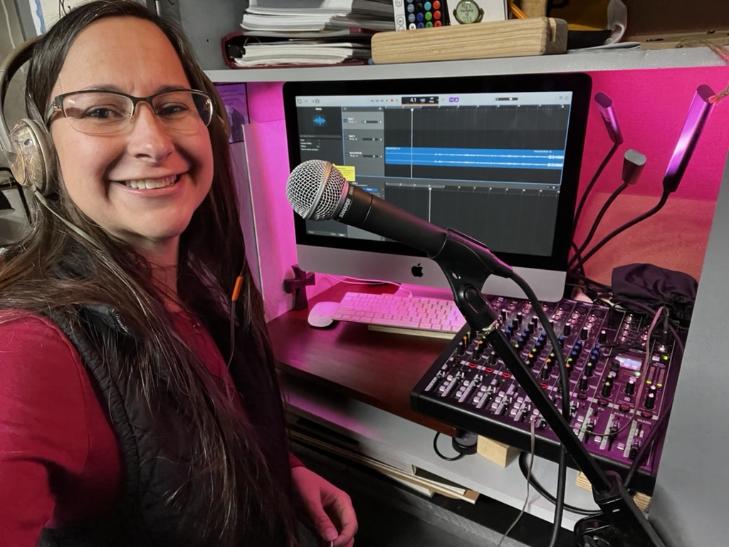 Jess at the mixing board in the studio